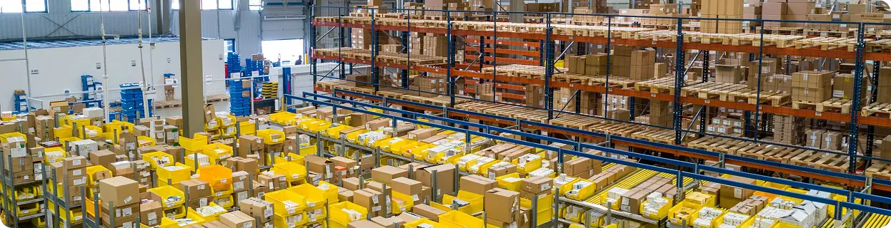 Warehouse team sorting parcels for logistics and courier delivery
